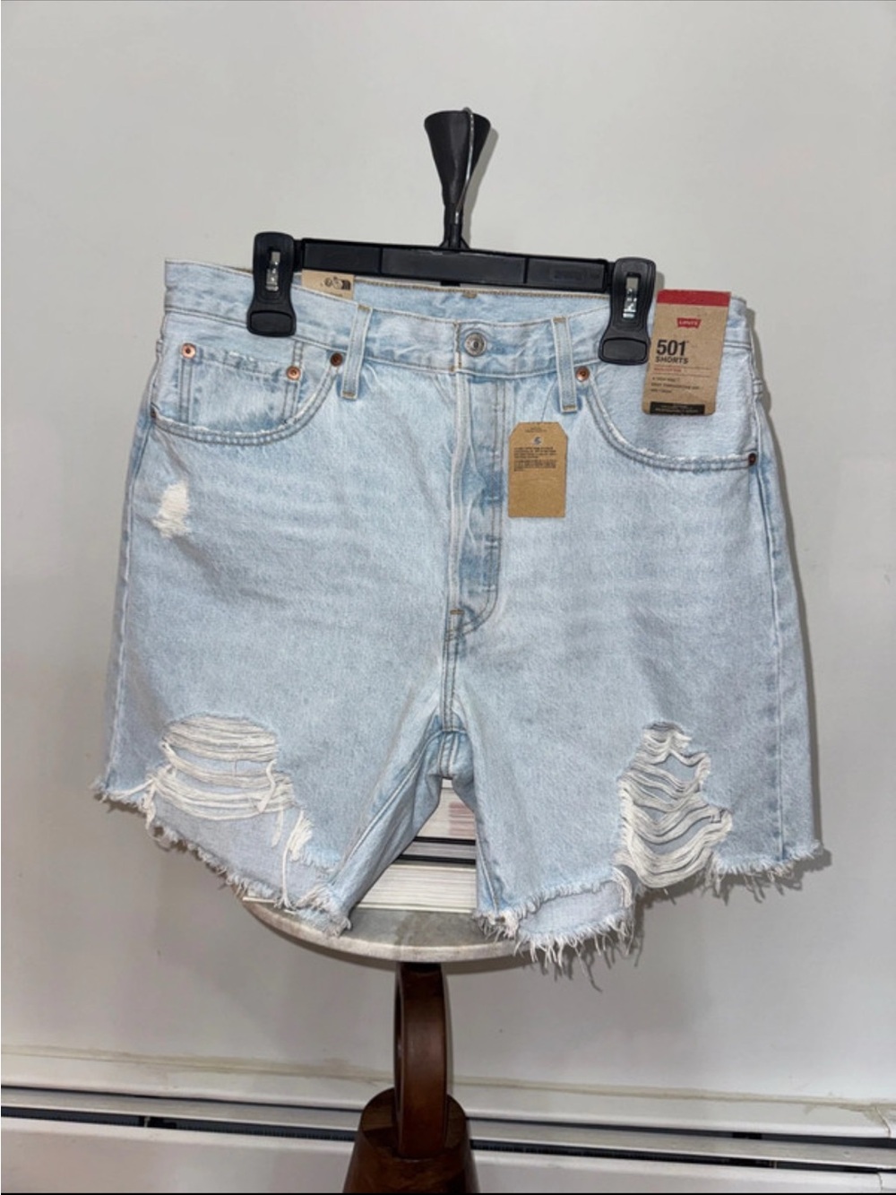 LEVI’S LIGHT BLUE DISTRESSED HIGH-RISE JEAN SHORTS